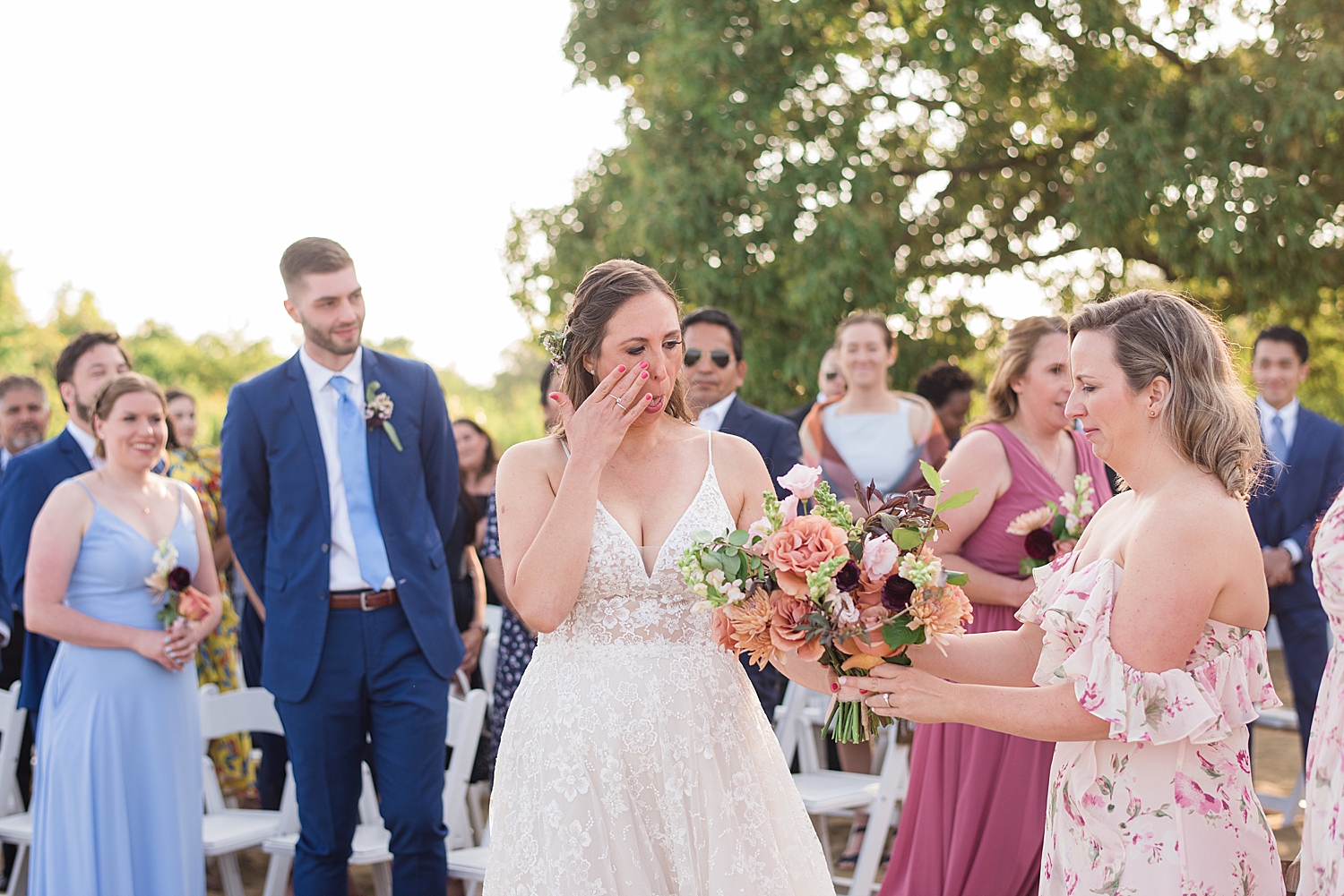 bride cries as she walks down aisle