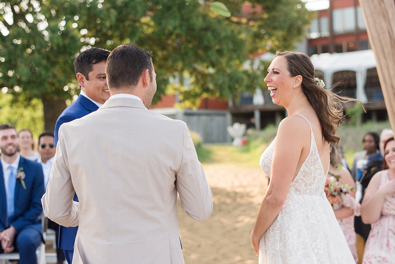 bride laughing during ceremony