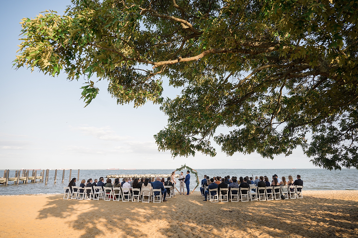 wide shot ceremony on the beach