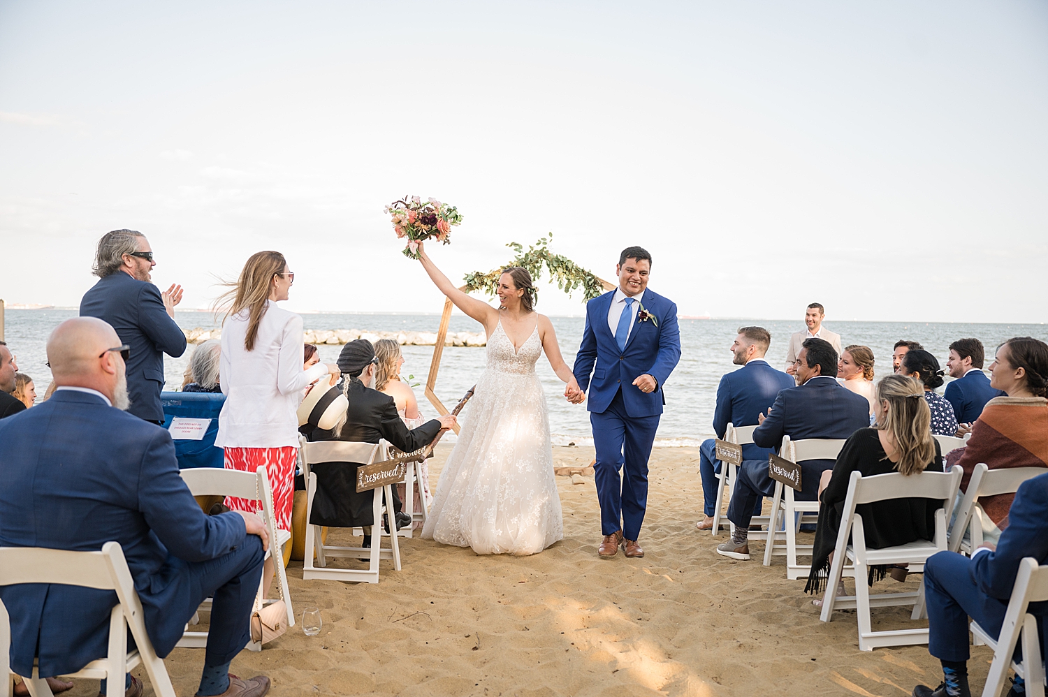 bride and groom celebrate and recess from ceremony