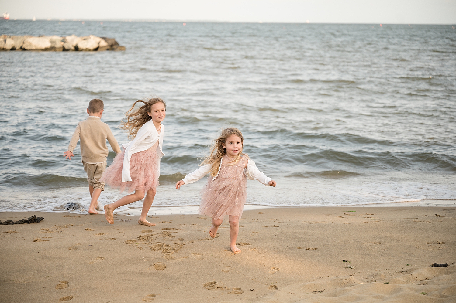 kids play in water on beach