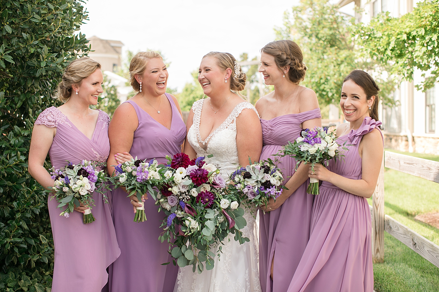 bridesmaids in lavender, laughing with bride