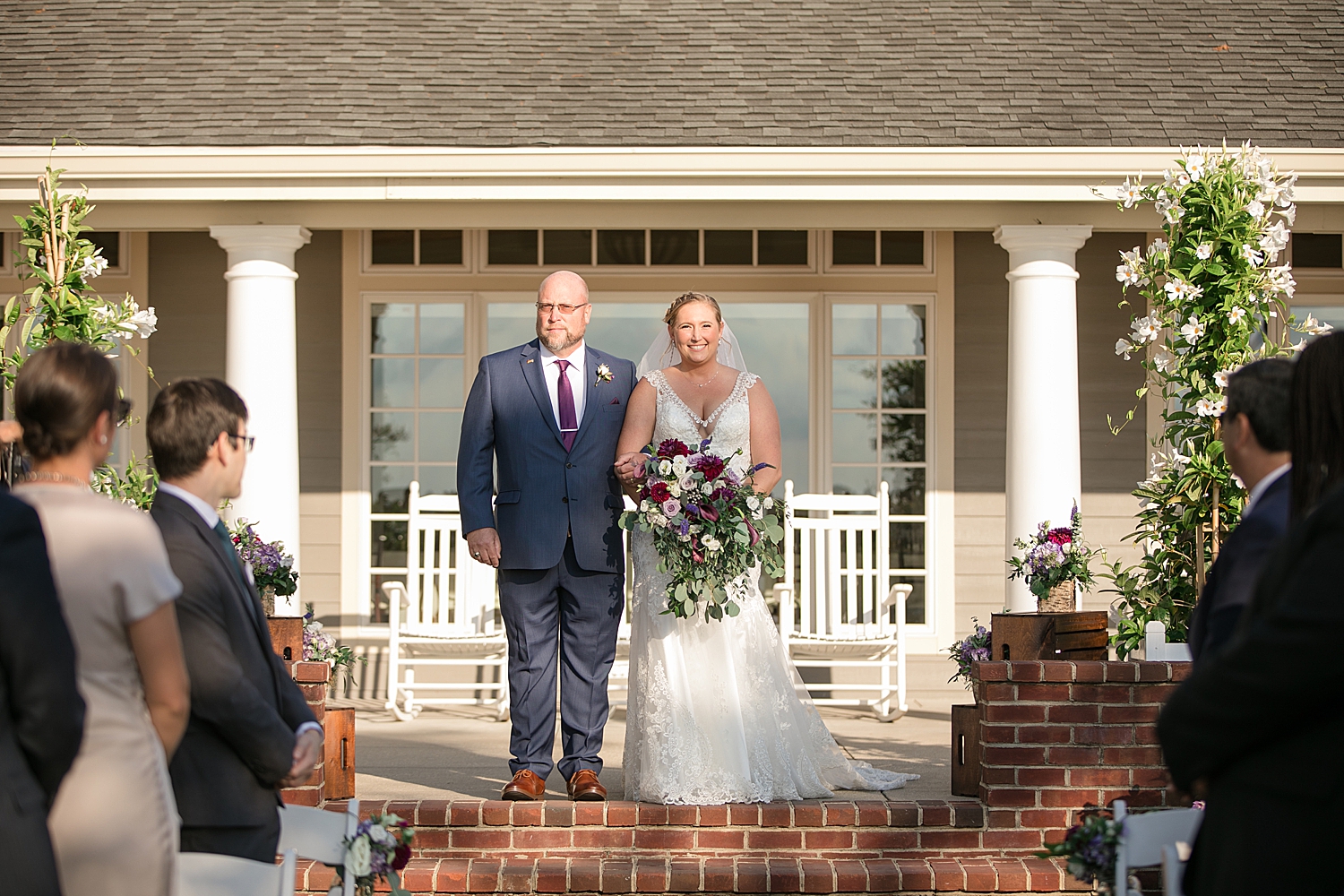 bride walking down aisle with dad