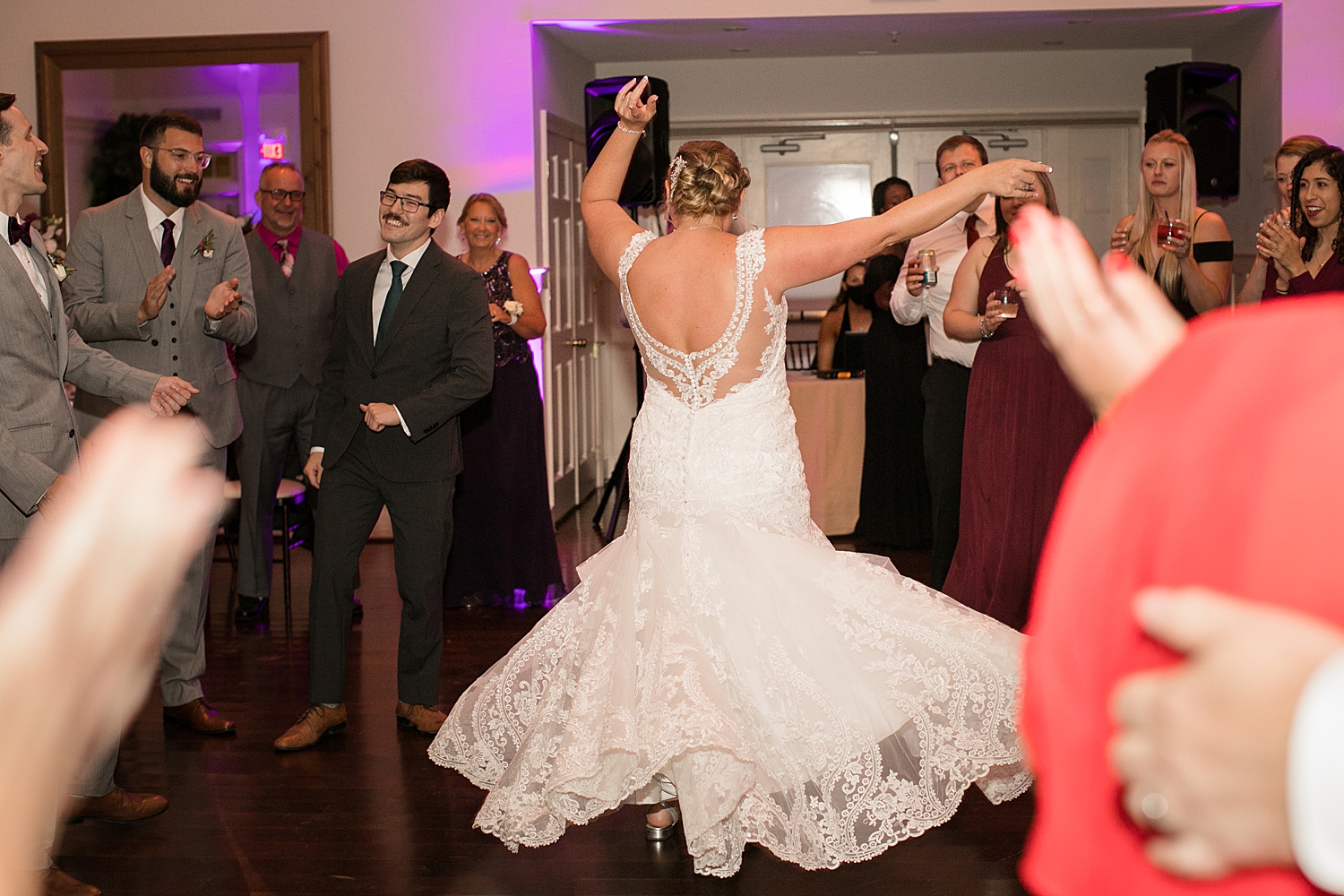 candid guests dancing ballroom, bride twirling