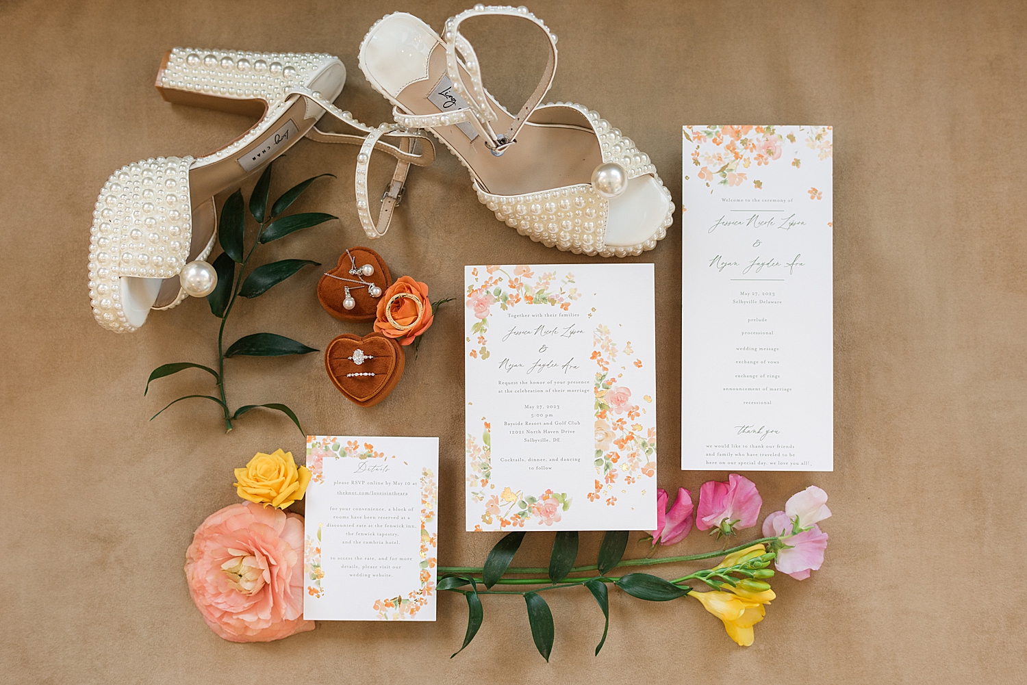 wedding flat lay spring yellow pink invites and shoes