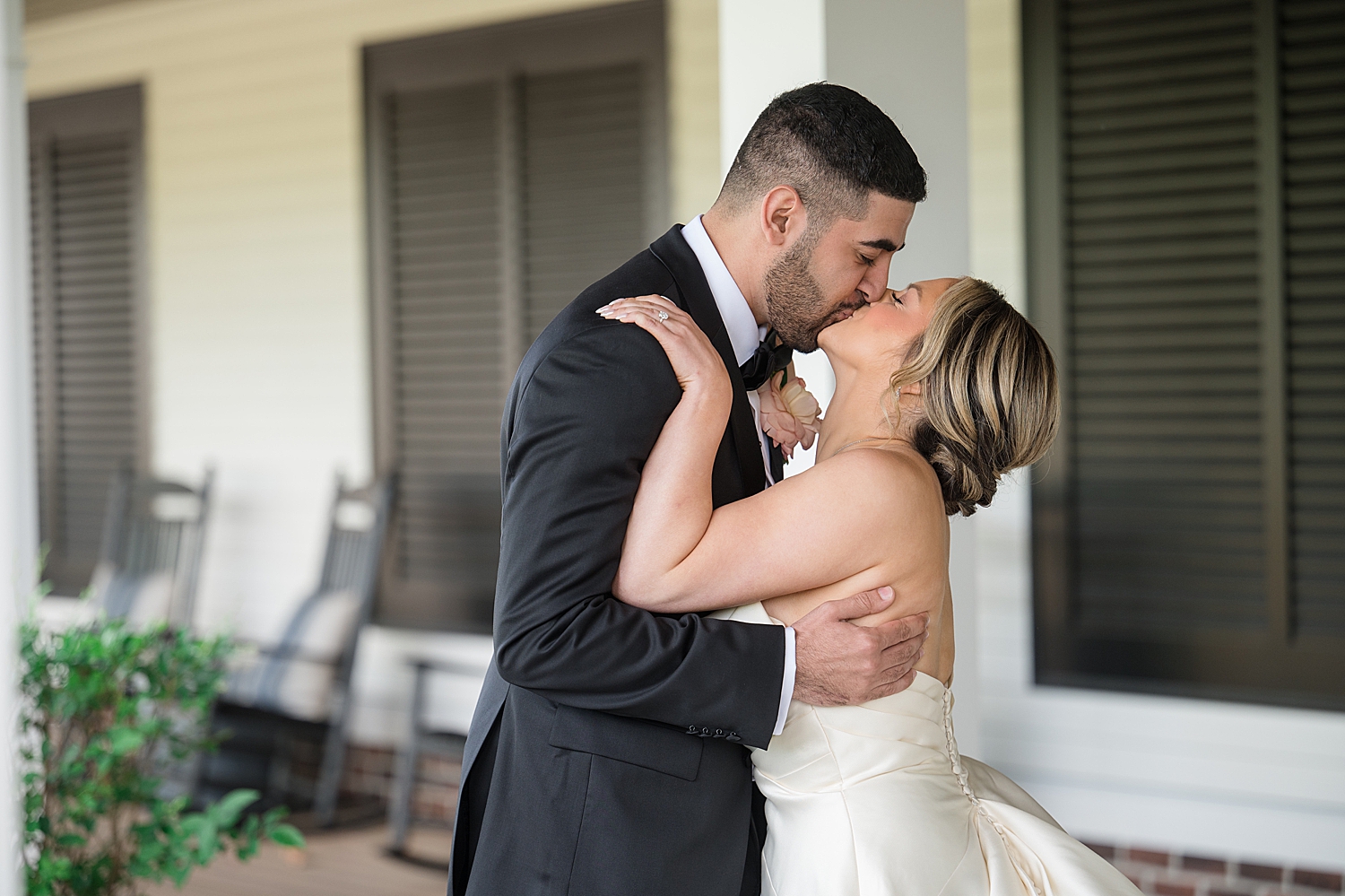 bride and groom kiss