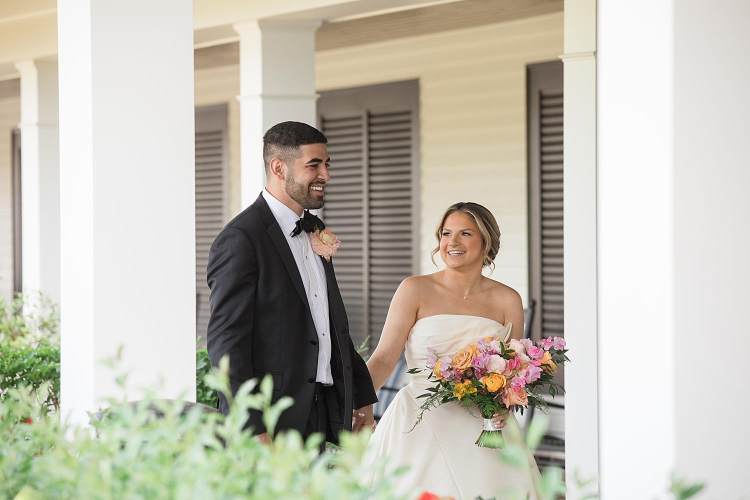 bride and groom smiling