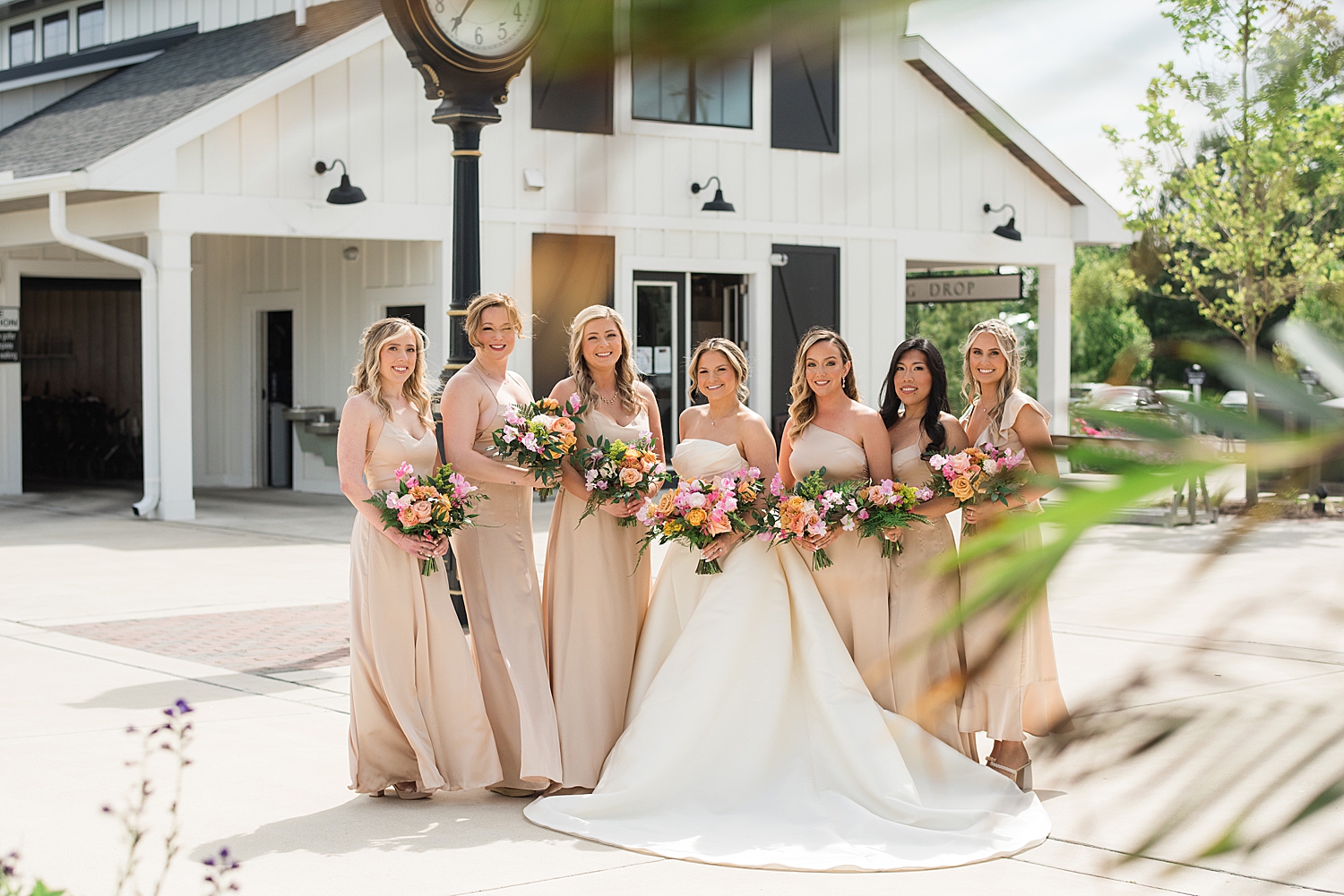 bride with bridesmaids in champagne gowns