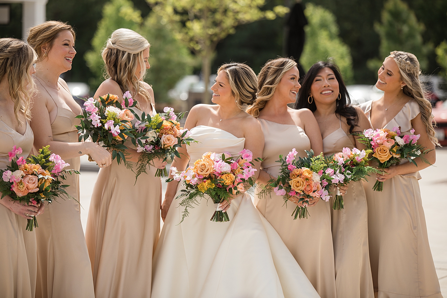 bride with bridesmaids in champagne gowns