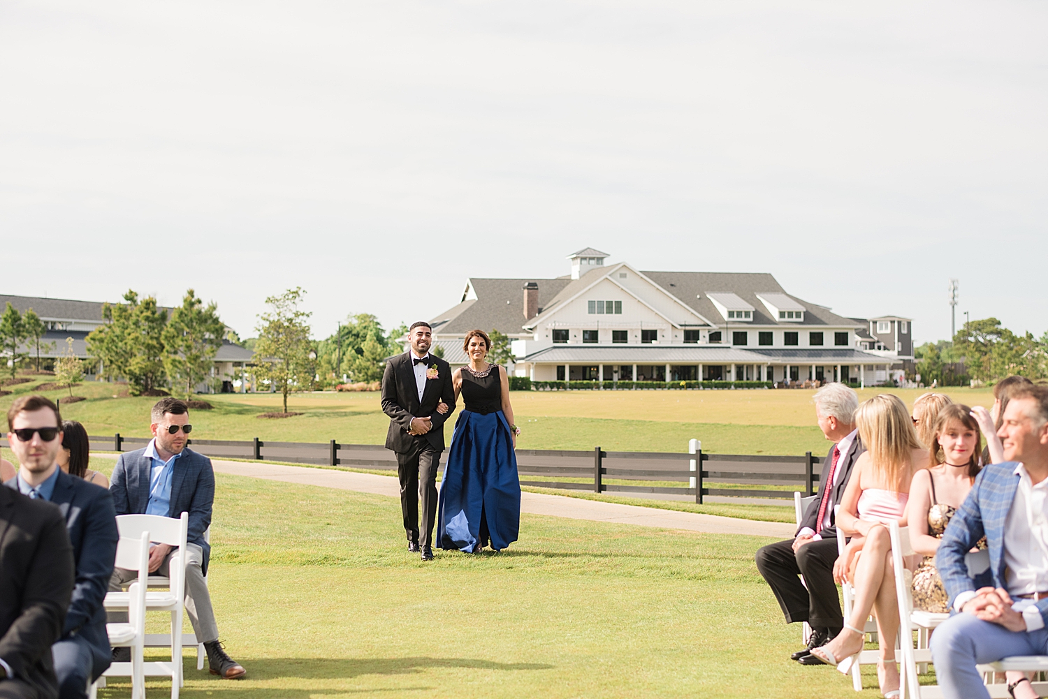 groom approaching ceremony with mom