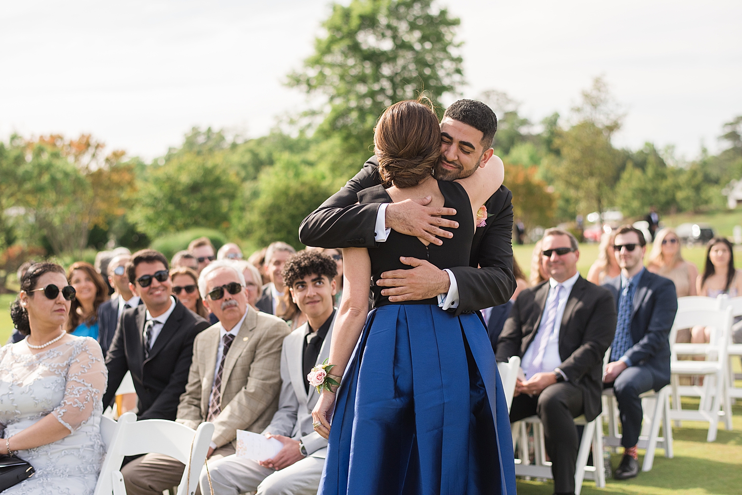 groom hugging mom