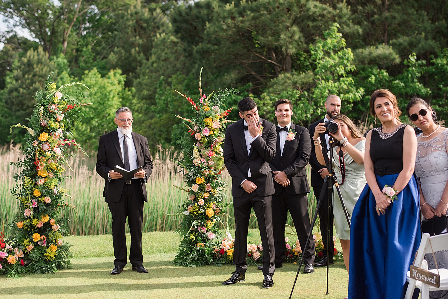 groom cries at the end of aisle