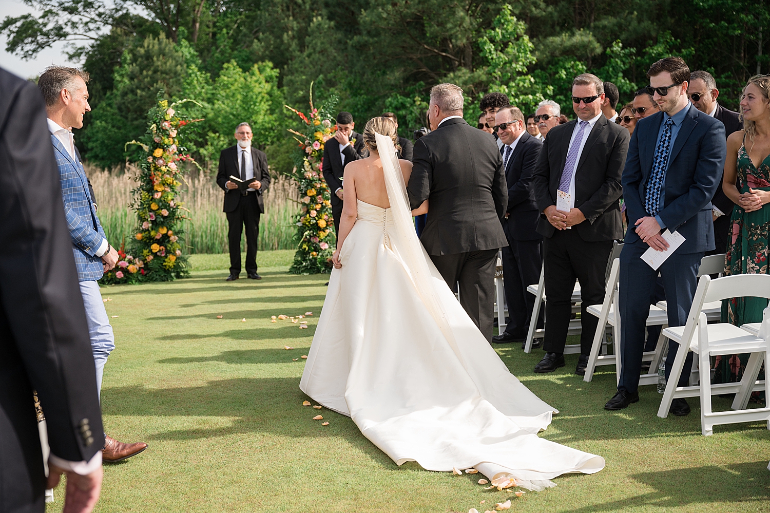 bride approaching ceremony with dad