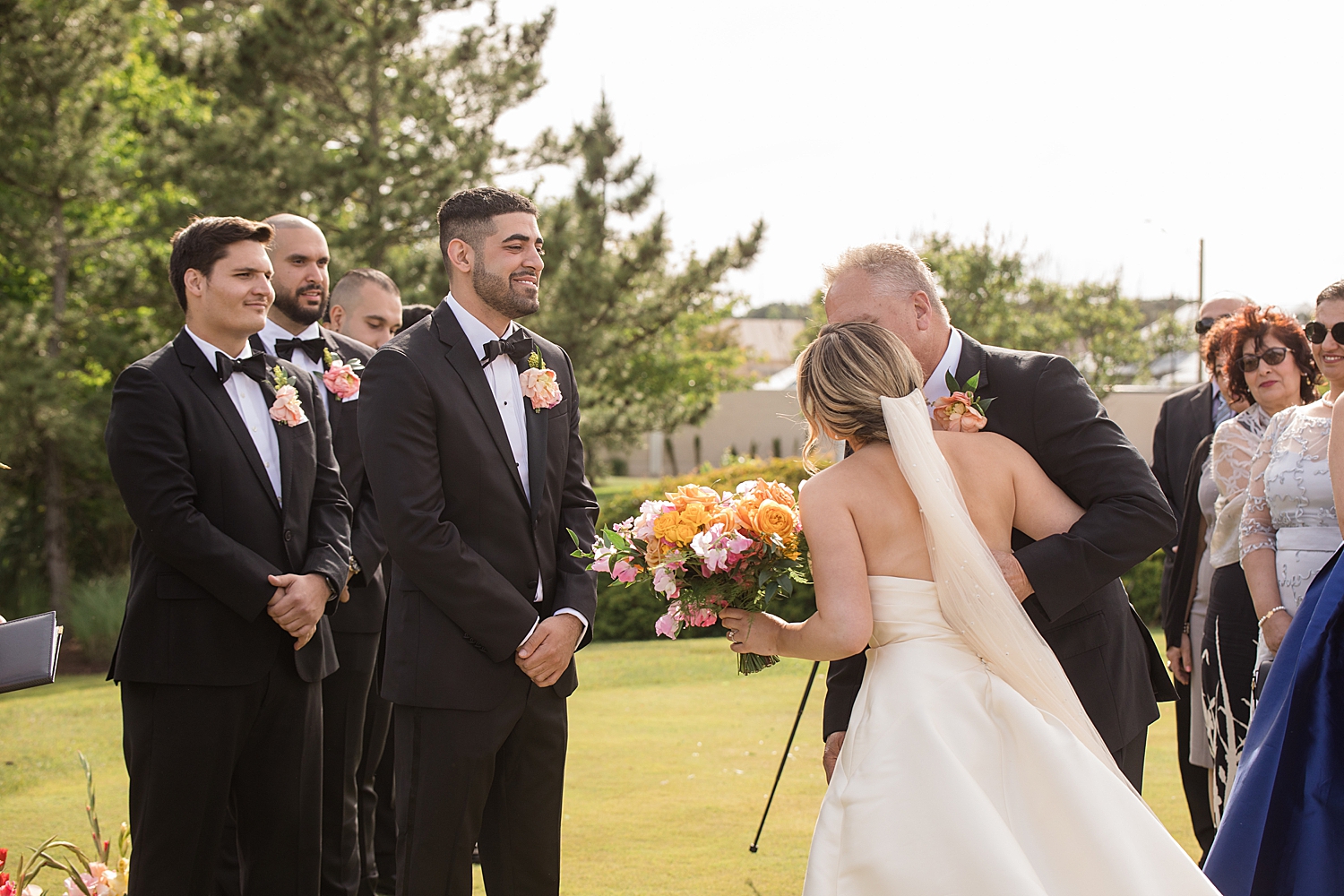 bride approaching ceremony with dad