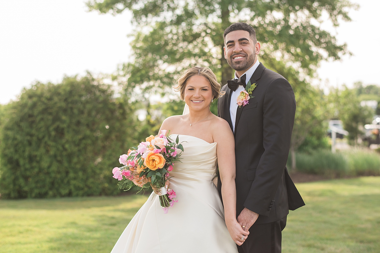 bride and groom couple portrait in grass