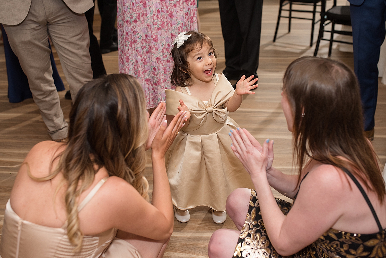 reception candid wedding guests dancing, flower girl