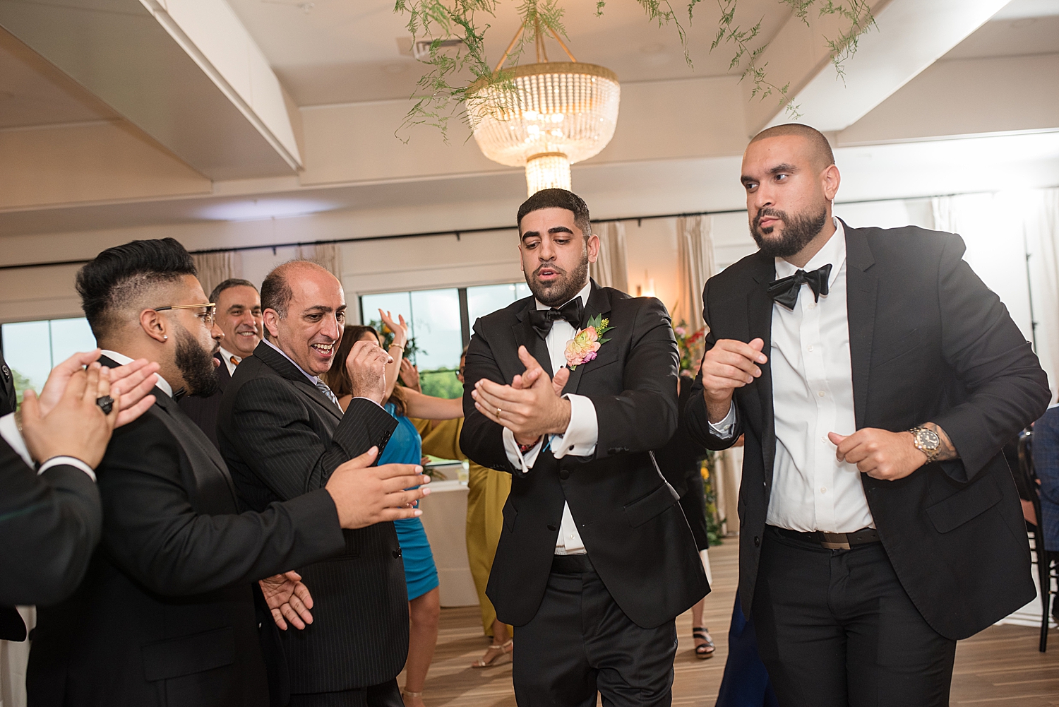 reception candid wedding guests dancing