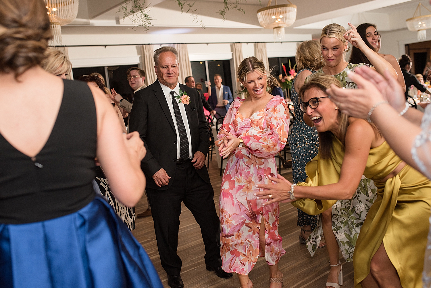 reception candid wedding guests dancing