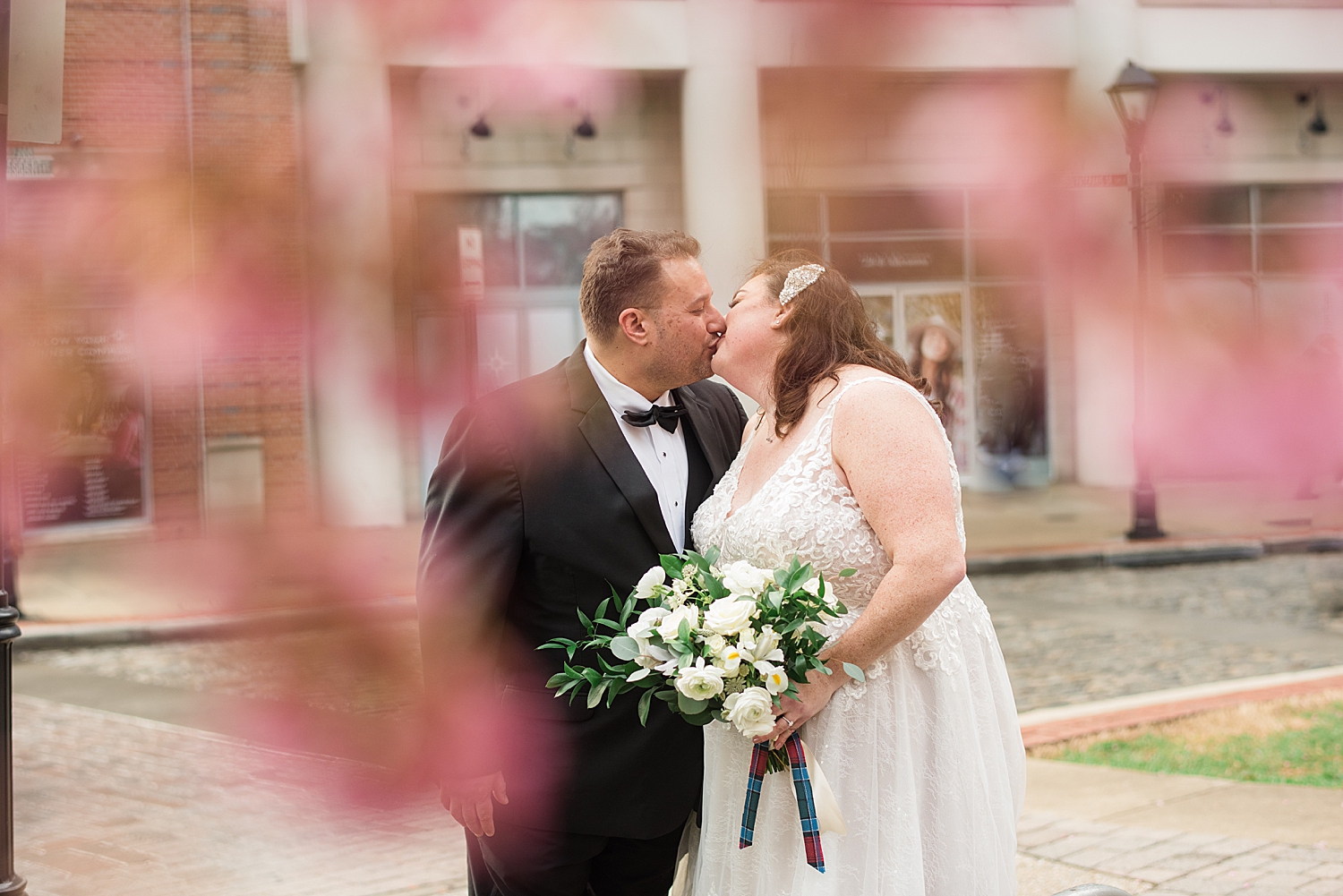 bride and groom portrait through flowers