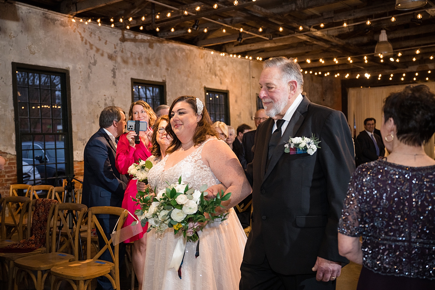 bride walking down the aisle with dad