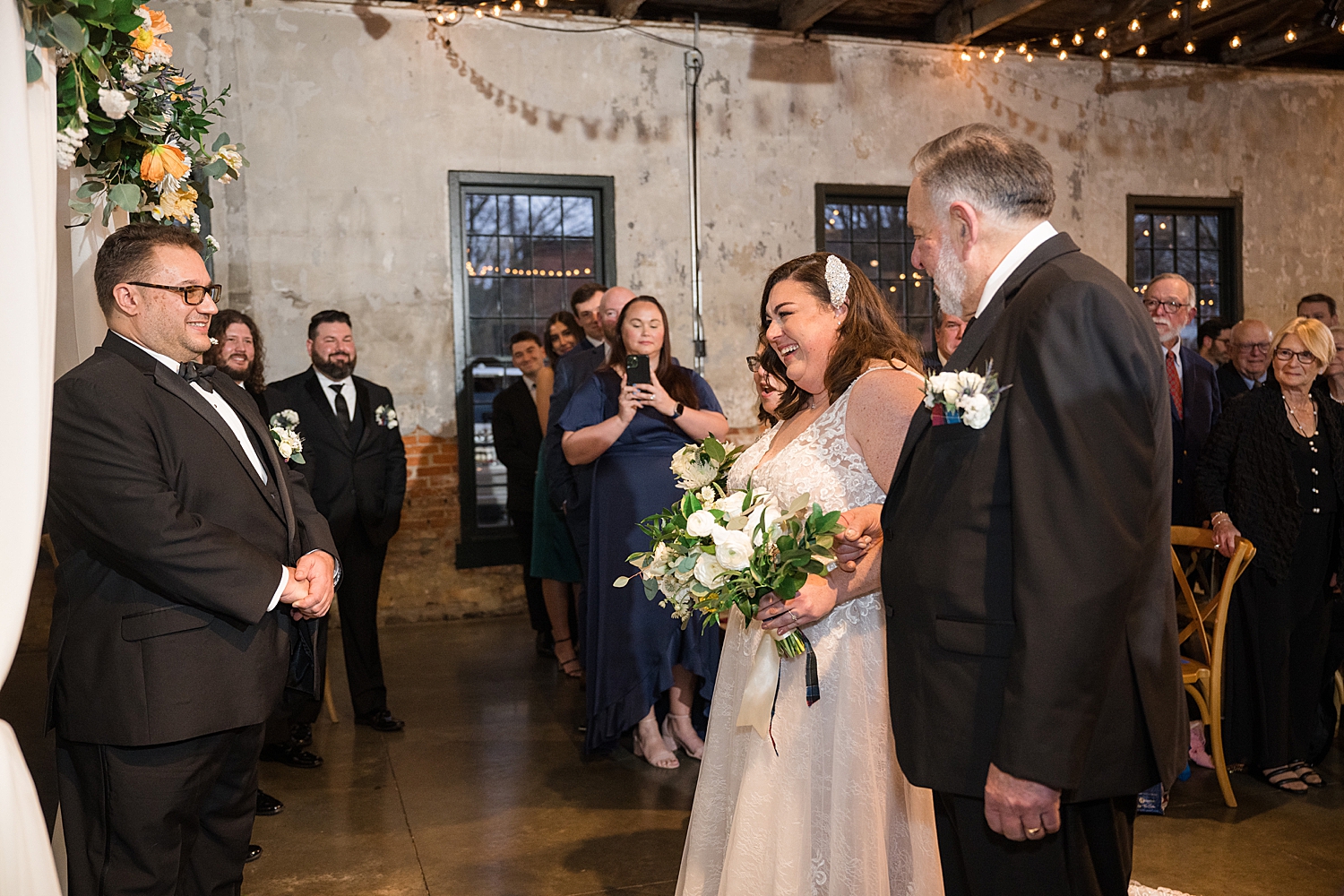 bride walking down the aisle with dad