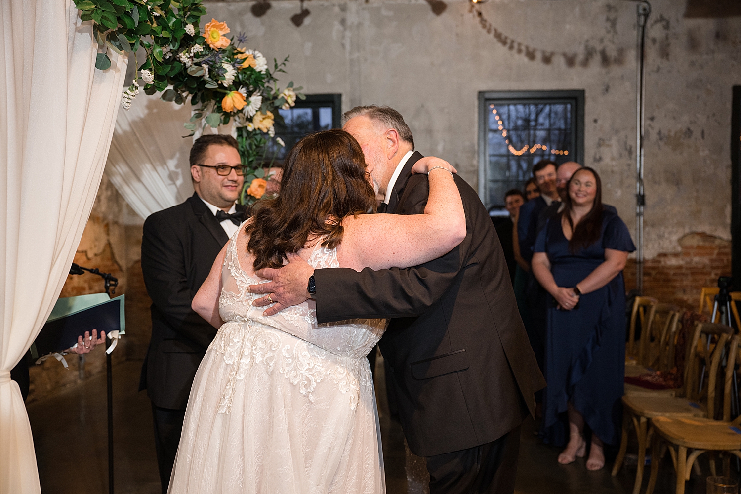 bride hugging dad during ceremony