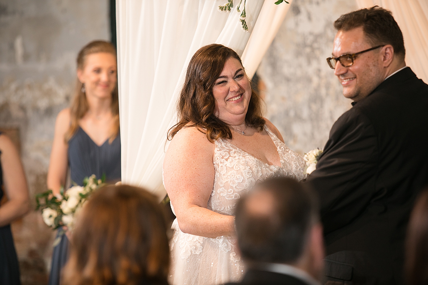 bride laughing during ceremony