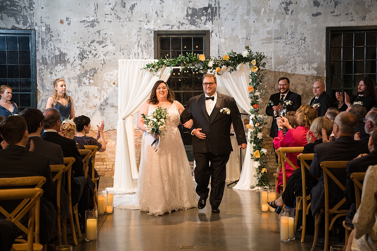 bride and groom recessing