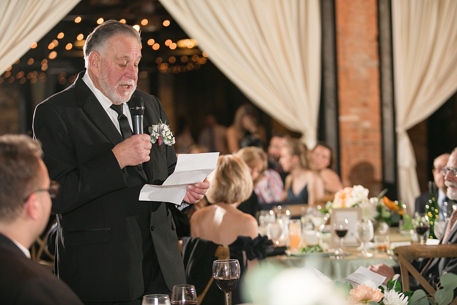 bride and groom listening and reacting to toasts