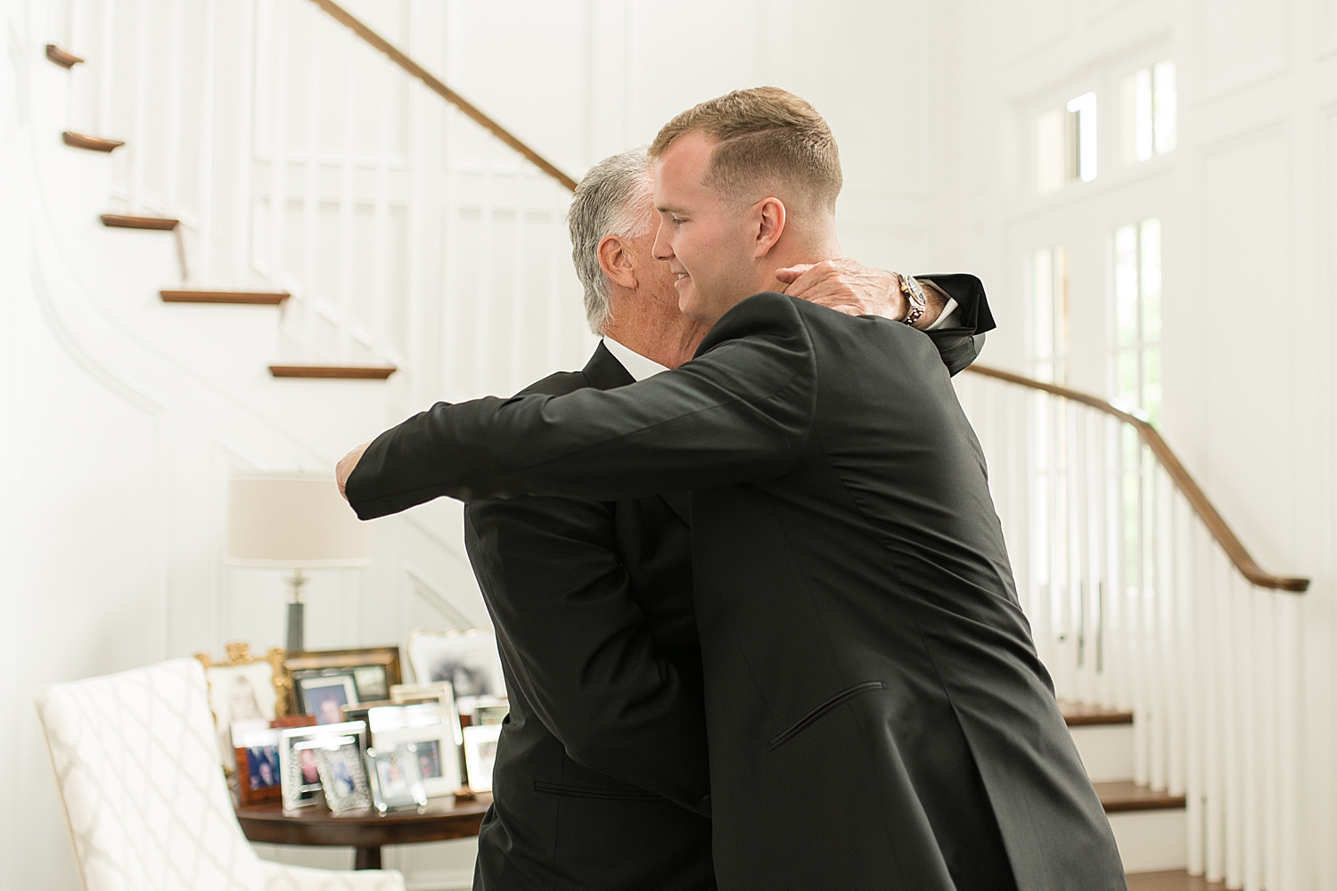 groom hugging son