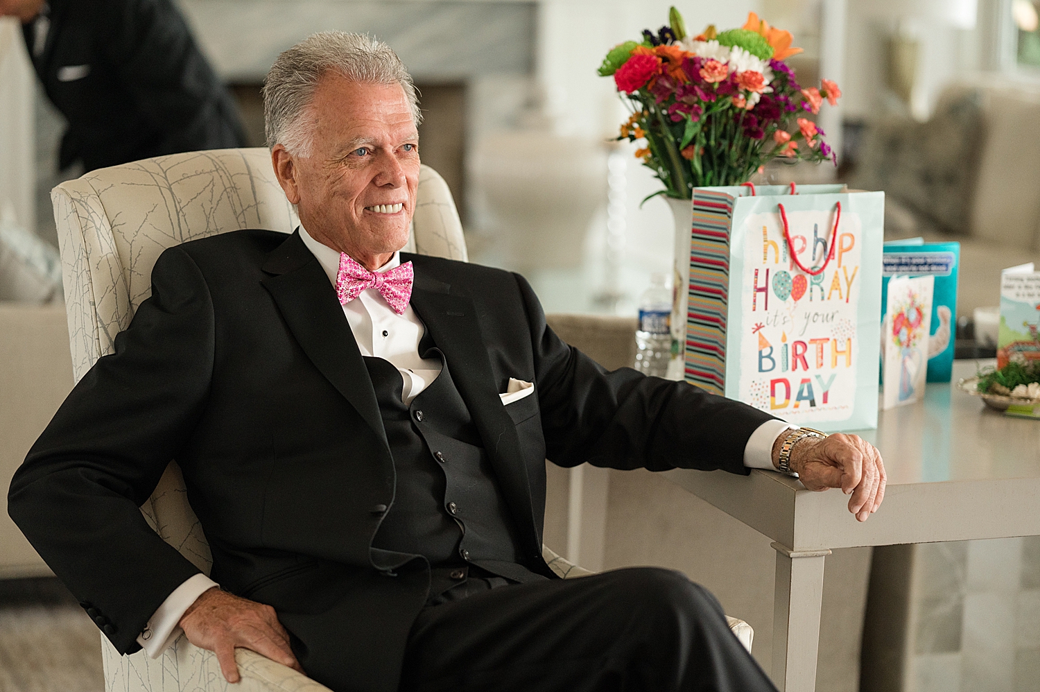 groom sitting while getting ready