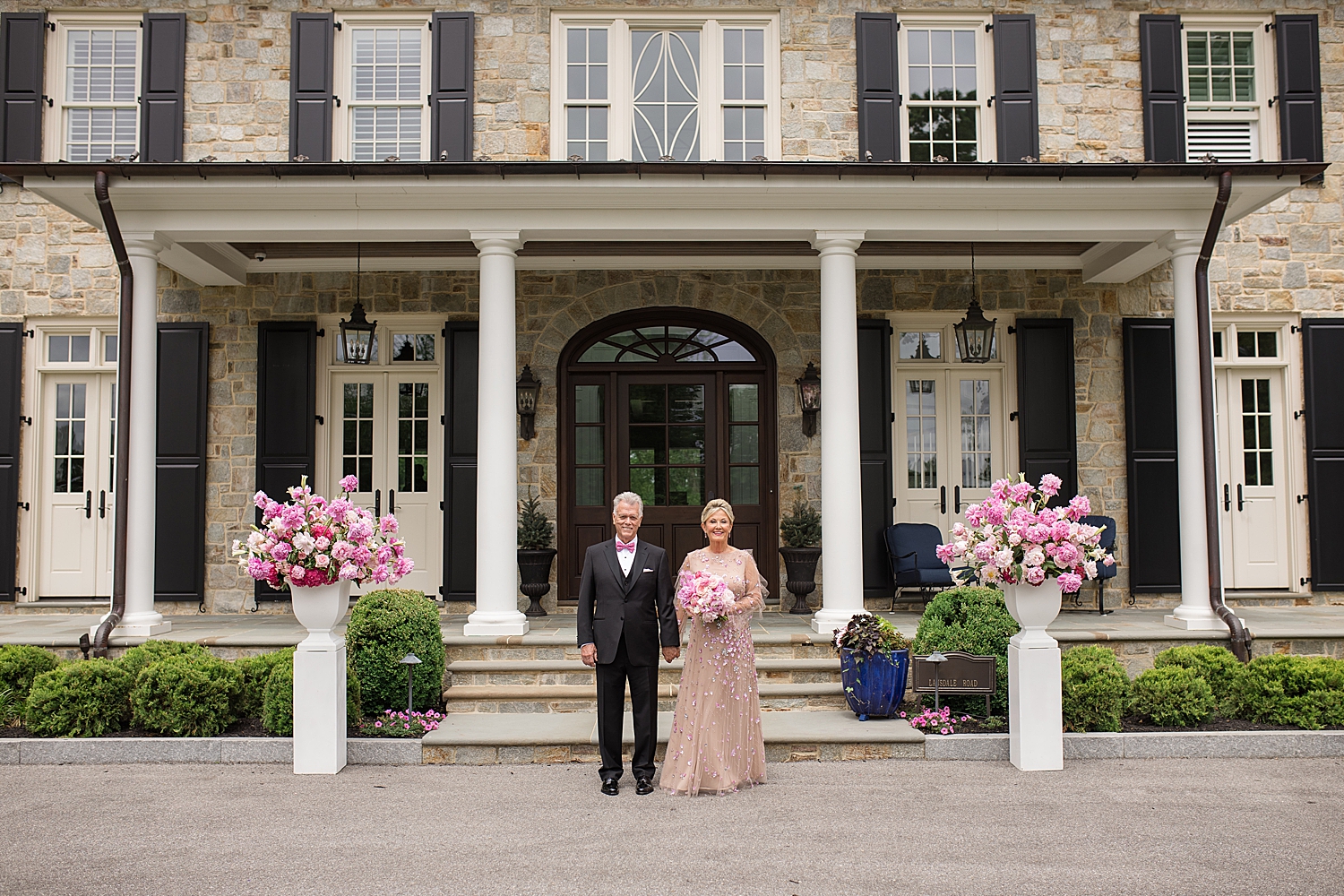 couple in front of home