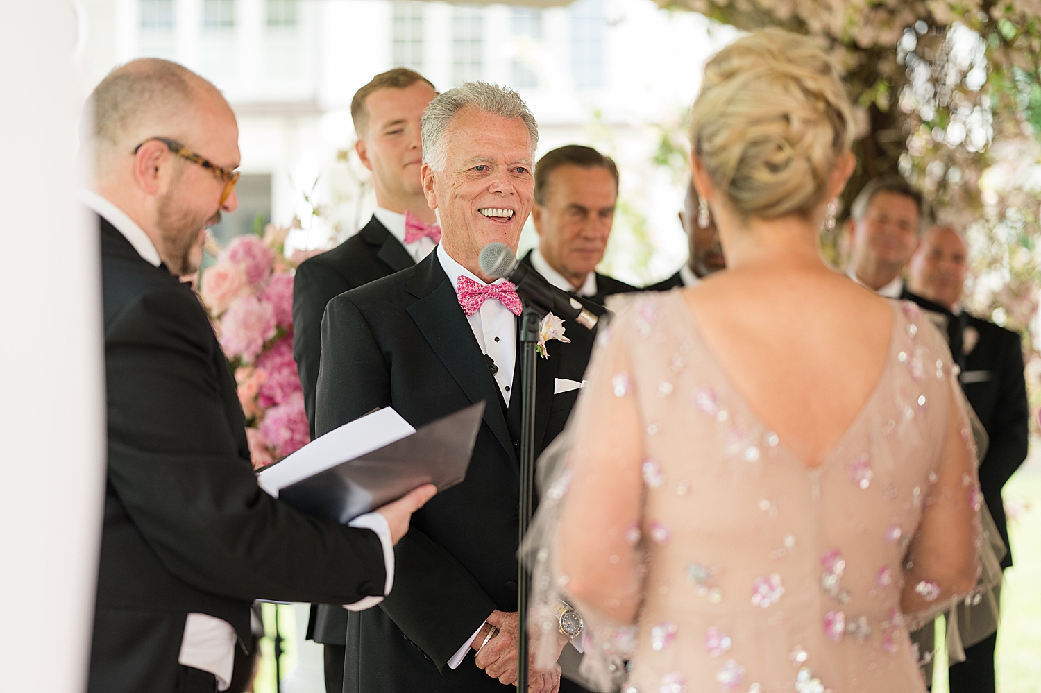 groom smiles during ceremony