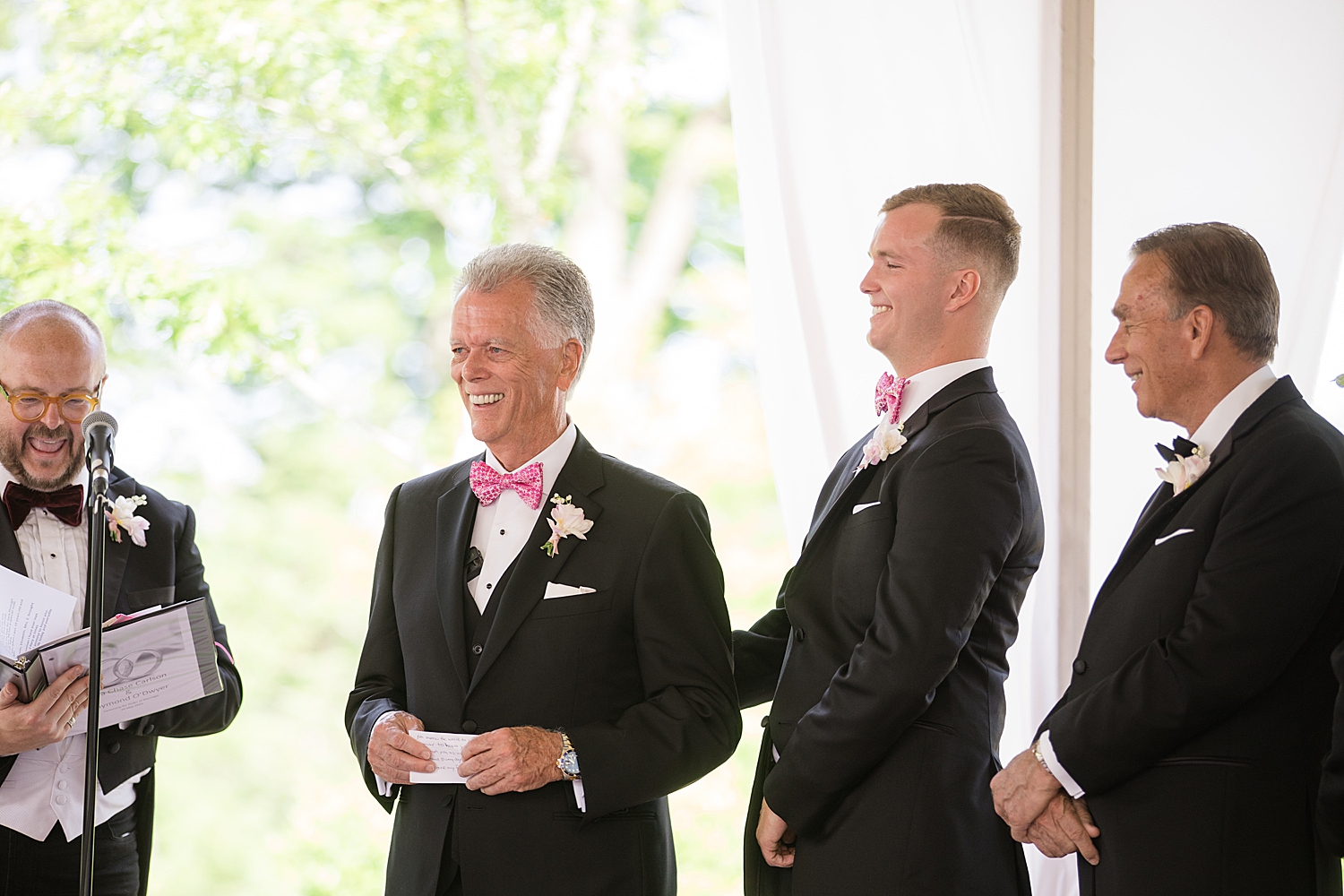 groom smiles during ceremony