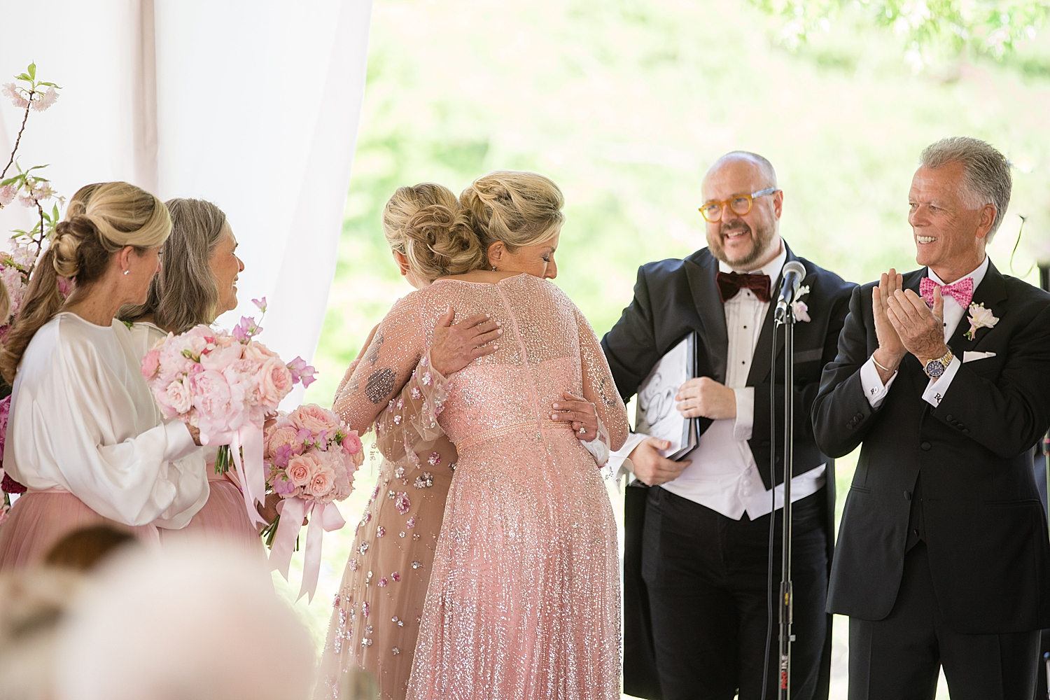 performer hugs bride