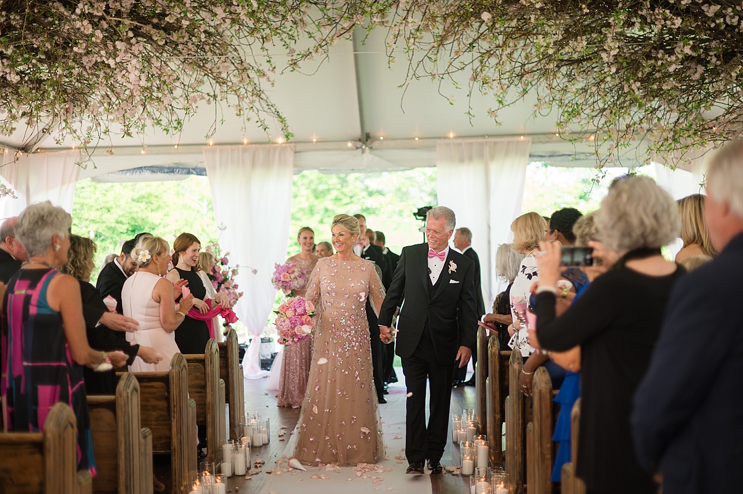 bride and groom recess with petals in the air