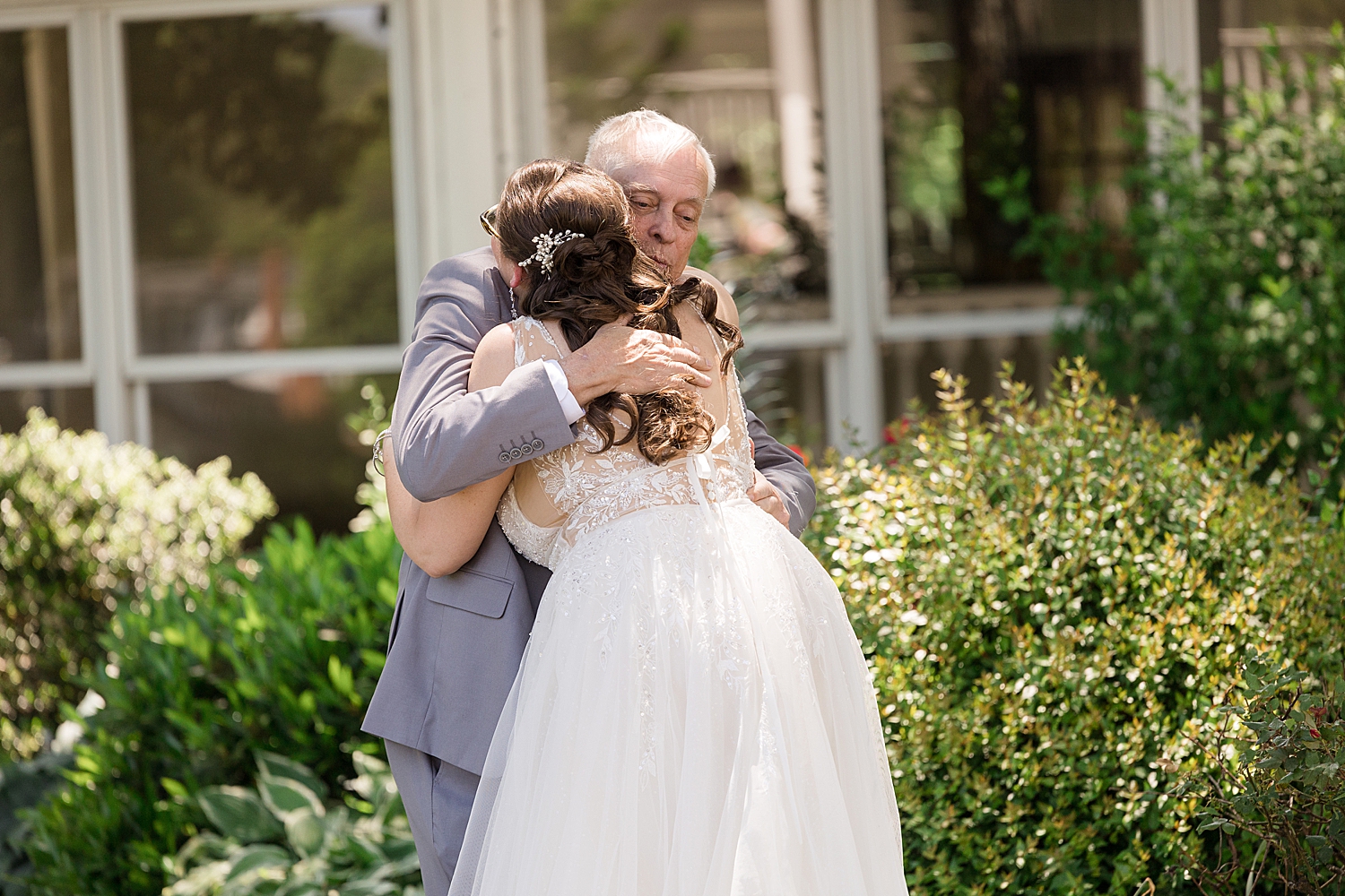 bride embracing dad