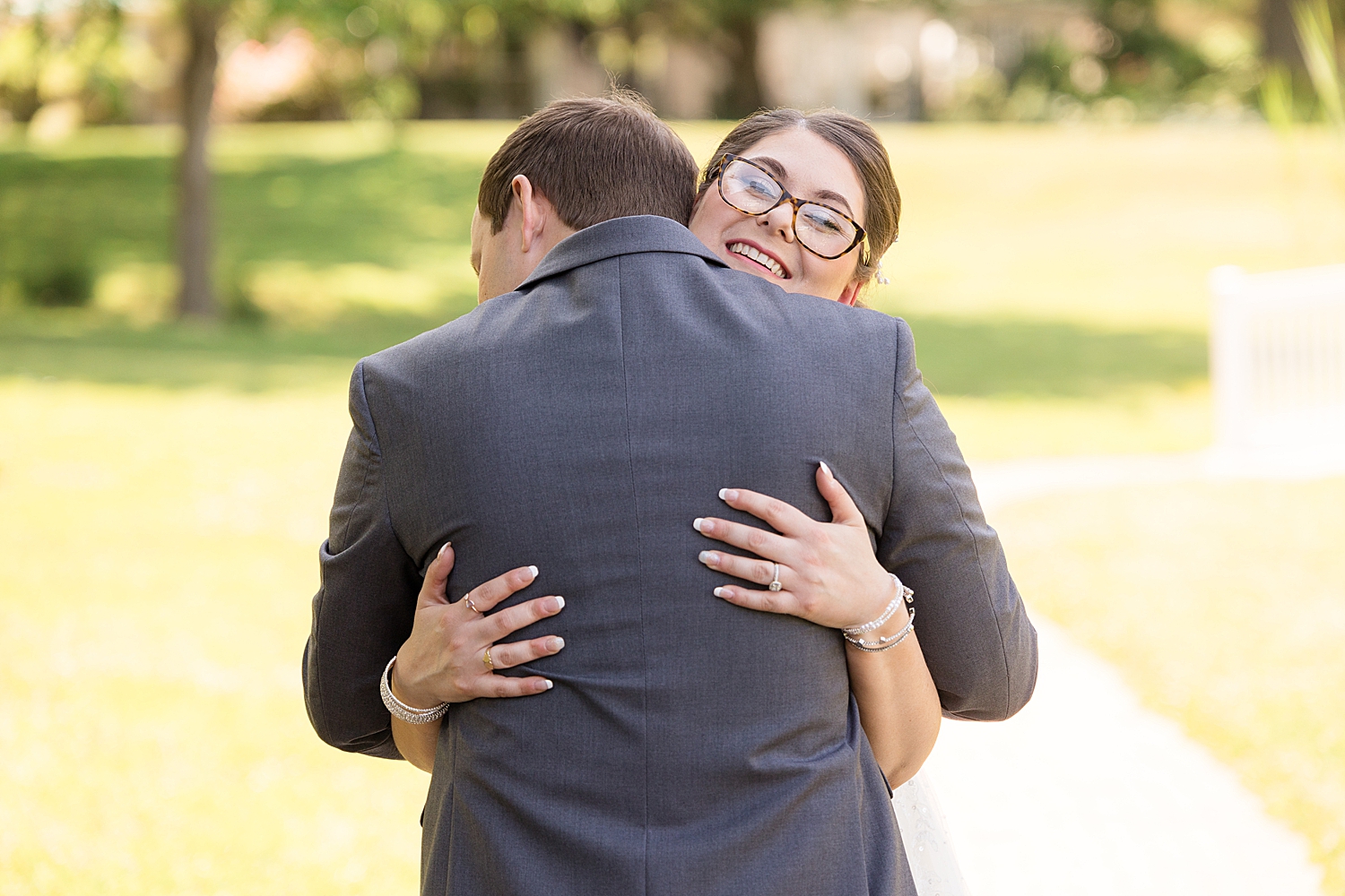 bride and groom first look embrace