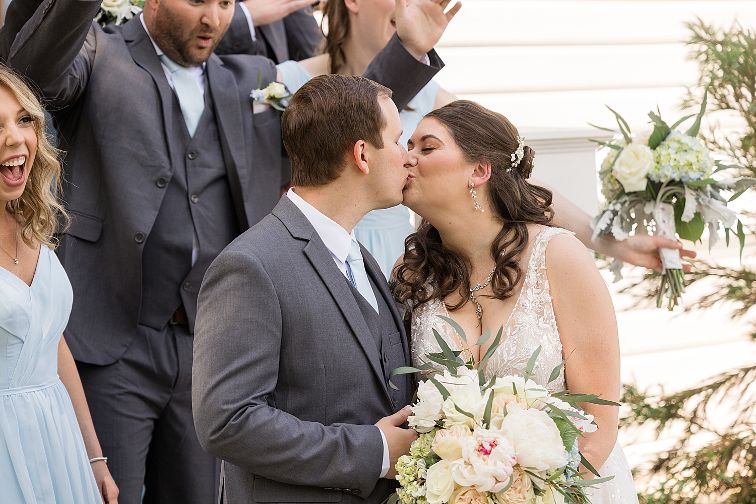 bride and groom kiss