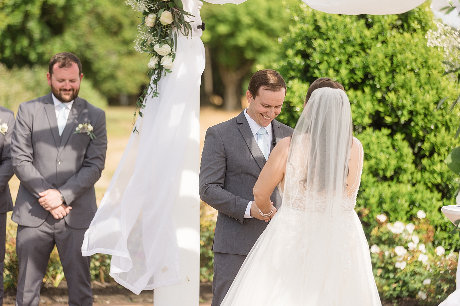 groom smiling during ceremony