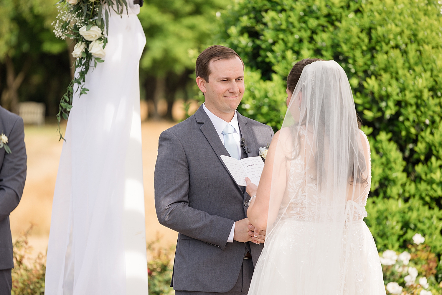 groom listening to bride's vows