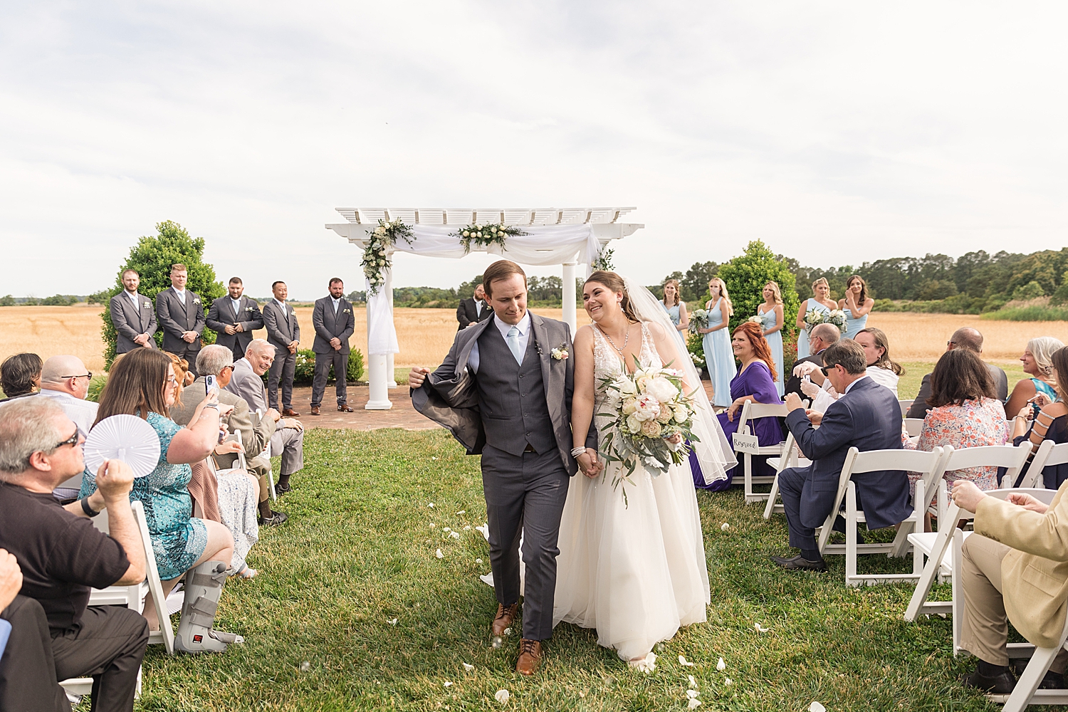 bride and groom recess down the aisle