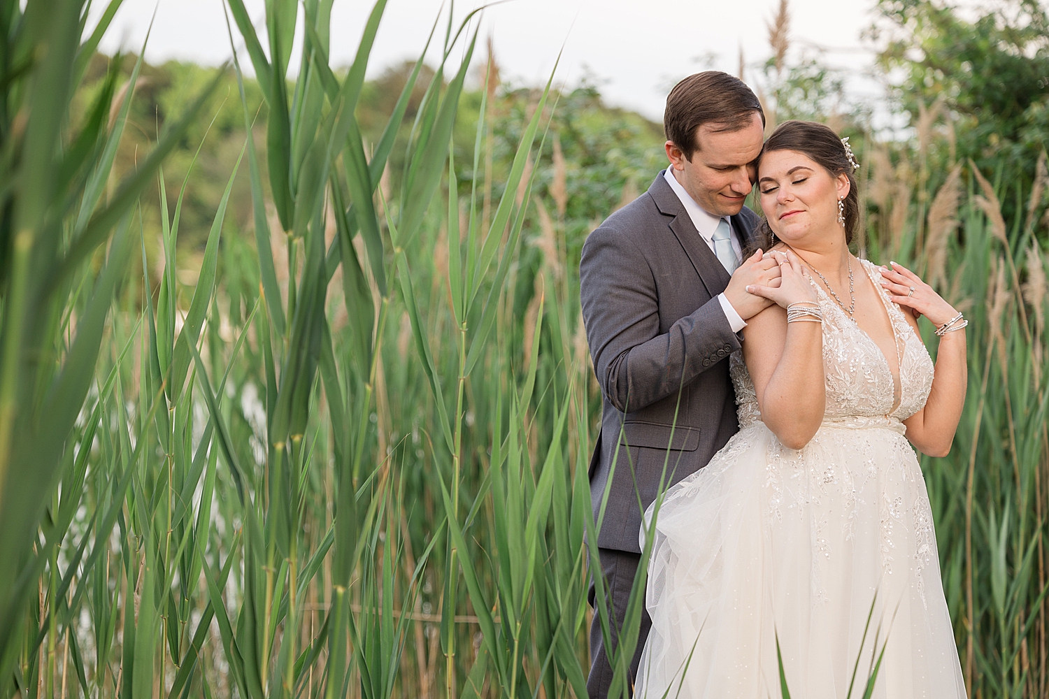 bride and groom portrait in bay grass