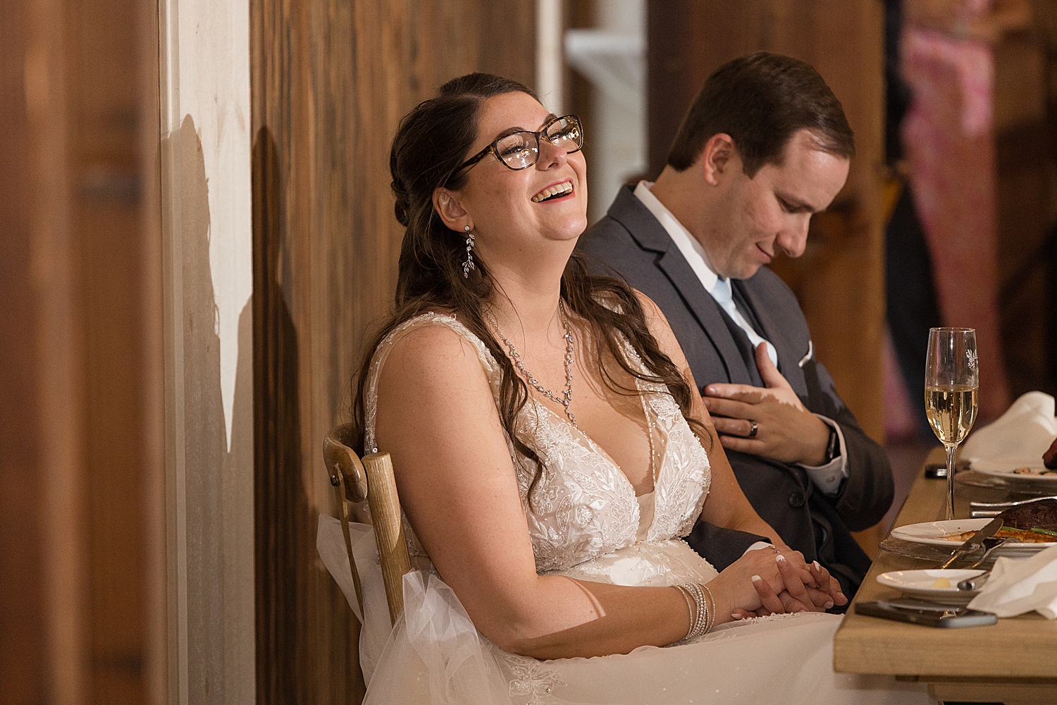 bride laughs during toasts