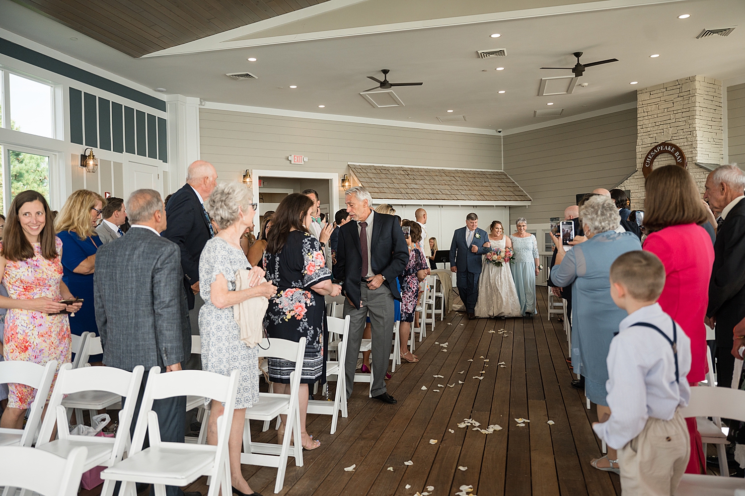 bride walks down aisle with parents