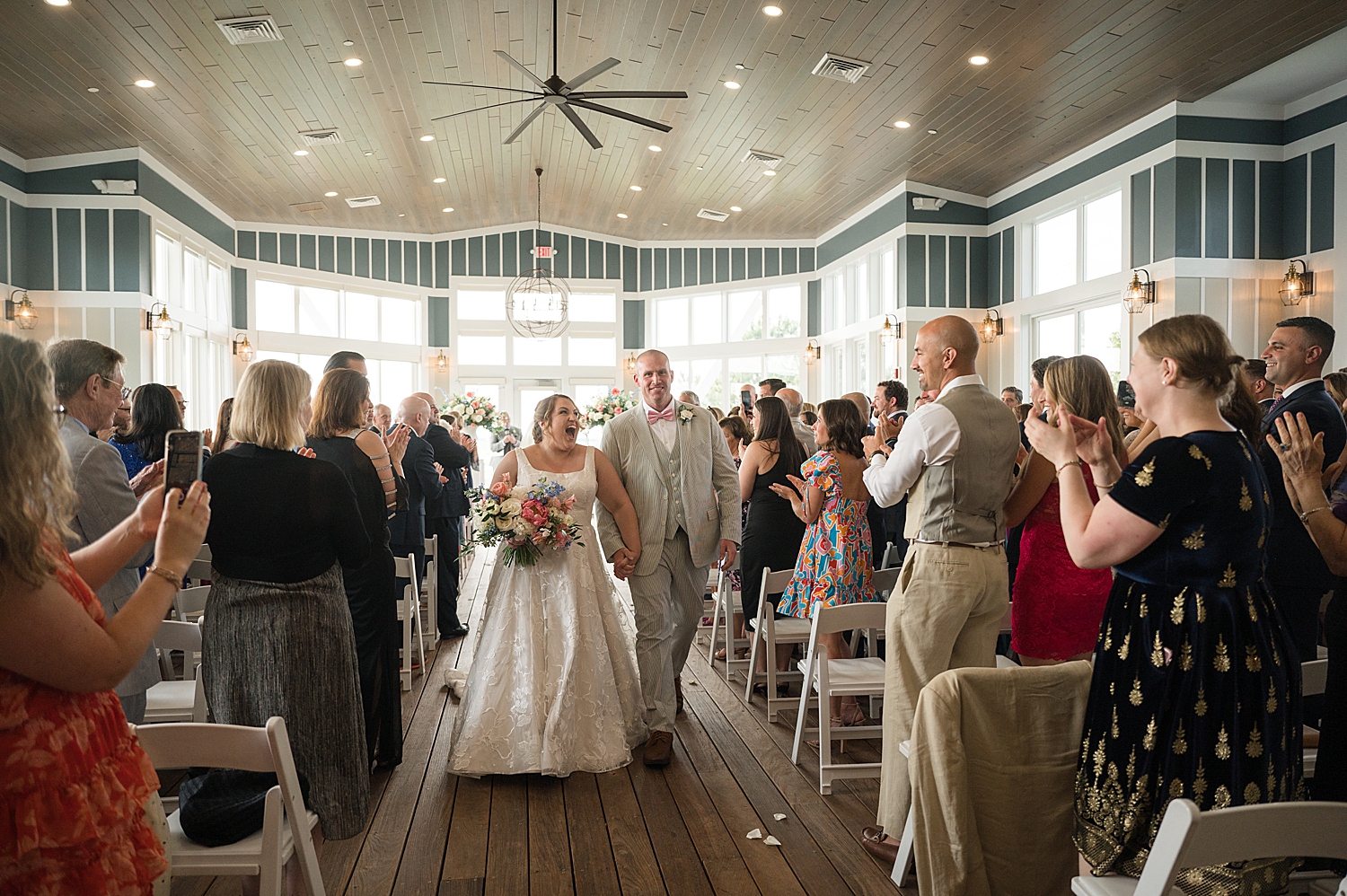 bride and groom recess down aisle