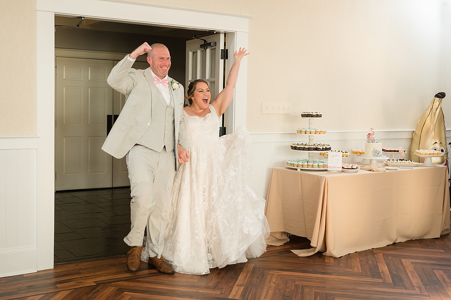 bride and groom cheer, enter reception