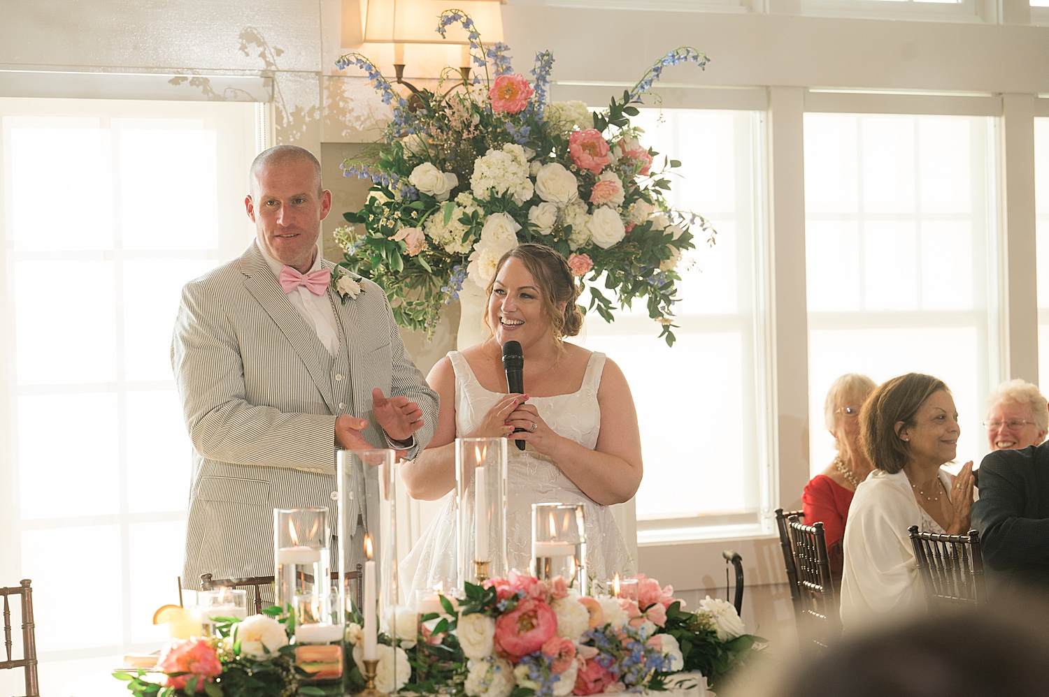 bride and groom give welcome toast