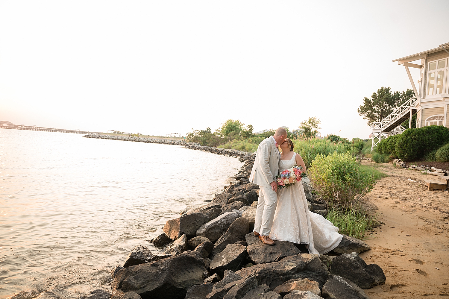 couple portrait on rocks at beach 