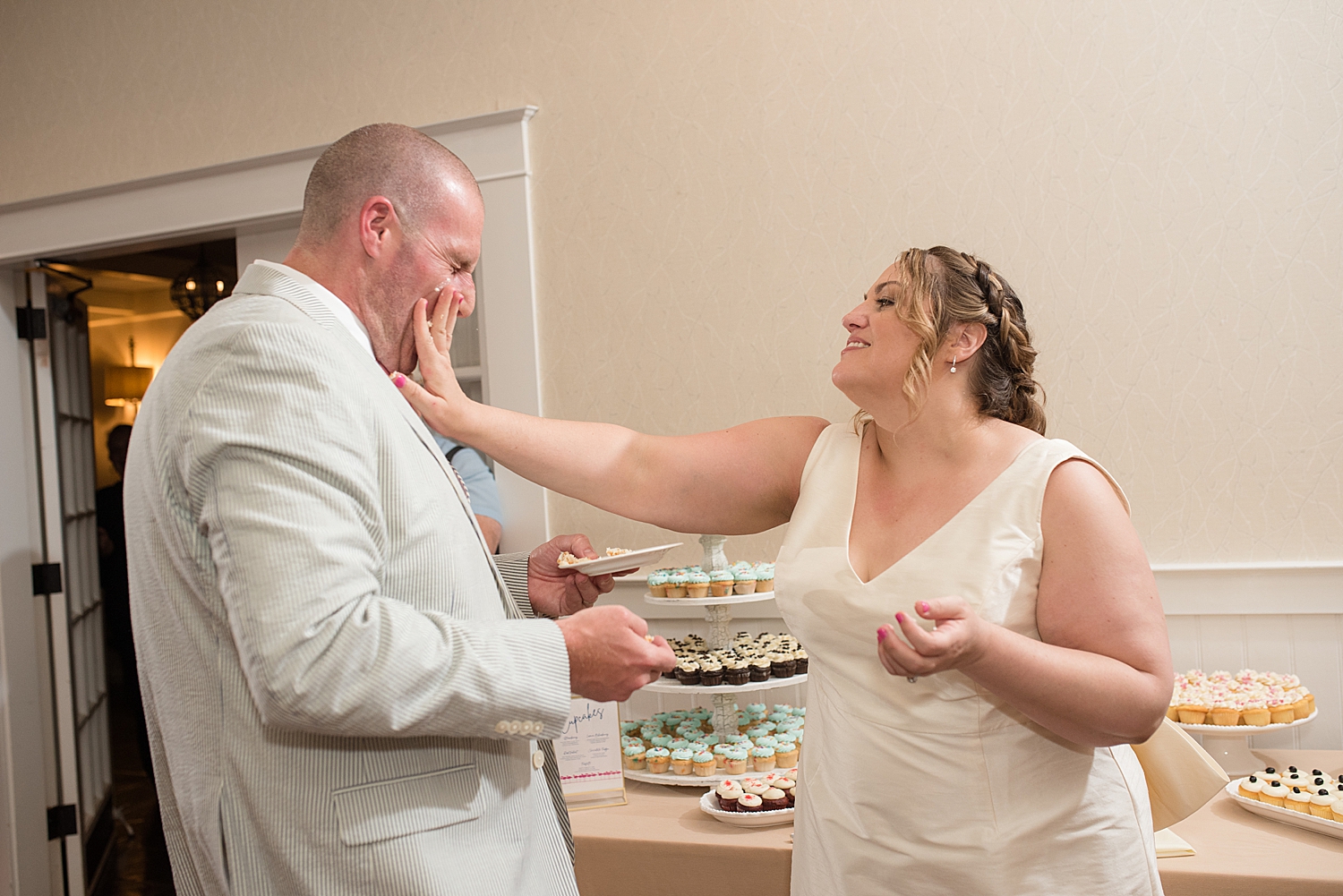 bride and groom cake cutting smash in face